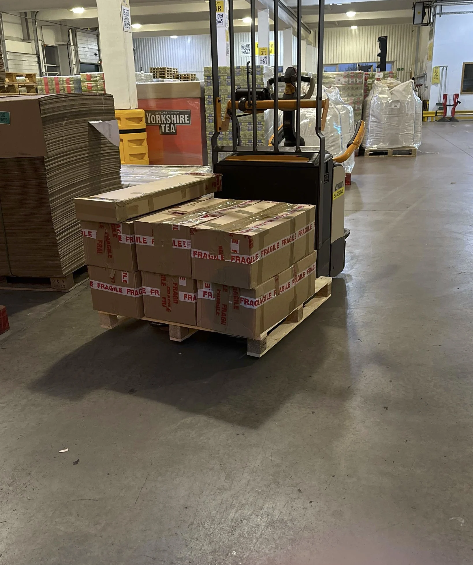 fragile-palletised-goods-handled-by-forklift-commercial-courier